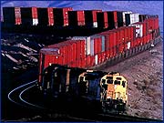 Diesel traction double stack intermodal container train for hauling time sensitive merchandise over continental distances